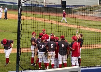 Independence huddles between innings to discuss its approach at the plate Wednesday in Bluefield.