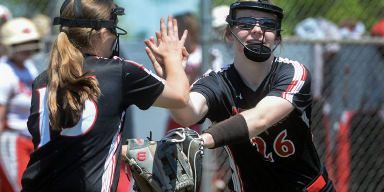 Tayven Stephenson (right) is congratulated by a  teammate. (Photo courtesy of the Charleston Gazette-Mail)