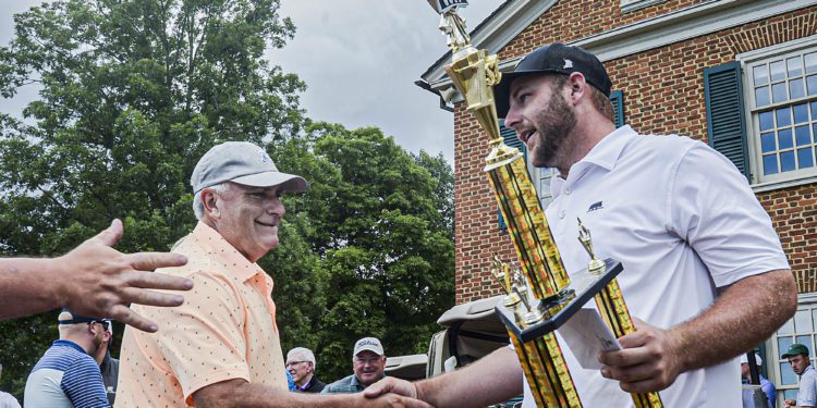 Mike Mays, left, shakes hands with 2021 Mountain State Golf Classic Champion Davey Jude last year at Glade Springs. (F. Brian Ferguson/Lootpress)