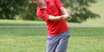 (Brad Davis/For LootPress) Oak Hill's Jack Hayes chips onto a green during a high school golf event at Bridge Haven Golf Club on Sept. 25 afternoon.