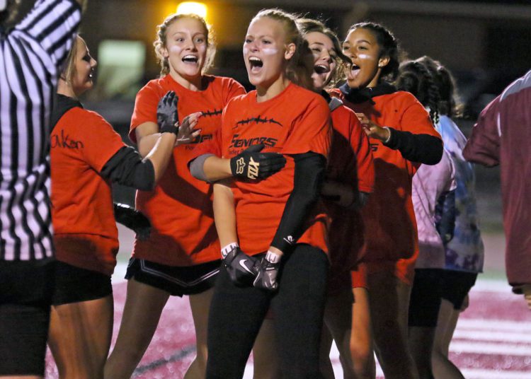 (Brad Davis/For LootPress) Woodrow Wilson Powderpuff Throwdown Seniors (orange) versus Sophomores (tie-dye) Monday night at Van Meter Stadium.