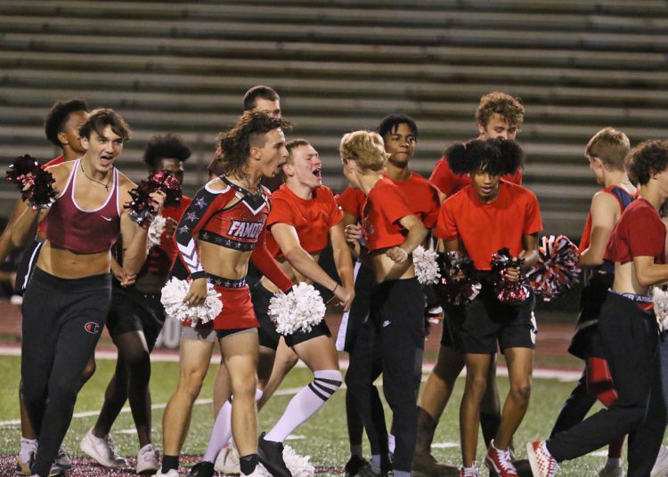 (Brad Davis/For LootPress) Woodrow Wilson Powderpuff Throwdown Senior cheer section Monday night at Van Meter Stadium.