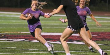 (Brad Davis/For LootPress) Woodrow Wilson Powderpuff Throwdown Freshmen (purple) versus Juniors (black) Monday night at Van Meter Stadium.