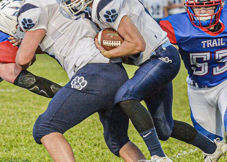 Meadow Bridge RB Devon Brown squeezes for extra yards against Midland Trail during a game Sept.10 in Hico. (F. Brian Ferguson/Lootpress).