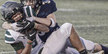 Wyoming East receiver Eli Fralin is taken down after the catch by Nicholas County’s Jaxson Morriston during Friday action in Summersville. (F. Brian Ferguson/Lootpress).