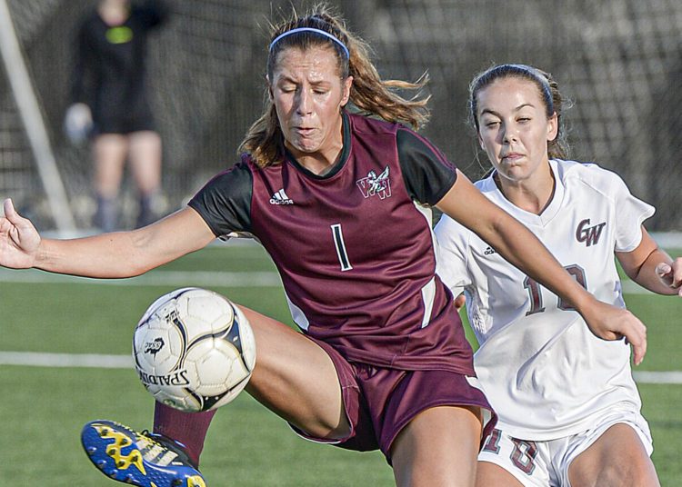 Woodrow Wilson’s Mya Wooton, left, and George Washington’s Ava Trethewey fight for the ball during a game last season in Beckley. (F. Brian Ferguson/Lootpress).