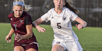 Woodrow Wilson’s Sophie Hall, left, and George Washington’s Katherine Akers fight for the ball Sept.30 in Beckley. (F. Brian Ferguson/Lootpress)