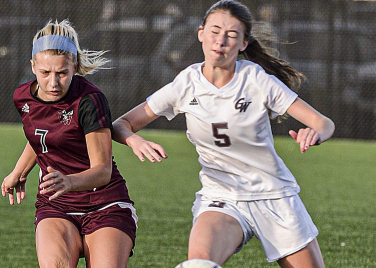 Woodrow Wilson’s Sophie Hall, left, and George Washington’s Katherine Akers fight for the ball Sept.30 in Beckley. (F. Brian Ferguson/Lootpress)