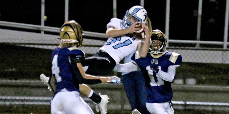 (Brad Davis/For LootPress) Mingo Central defensive back Nathan Hynd leaps to intercept a pass intended for Shady Spring's Jacob Showalter Friday night at Shady.