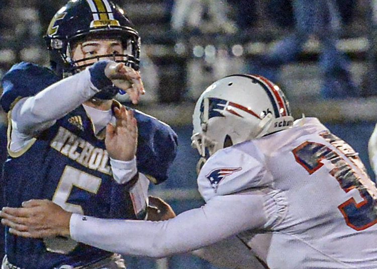 Nicholas County QB Brycen Morriston throws under pressure from Independence during Friday action in Summersville. (F. Brian Ferguson/Lootpress).