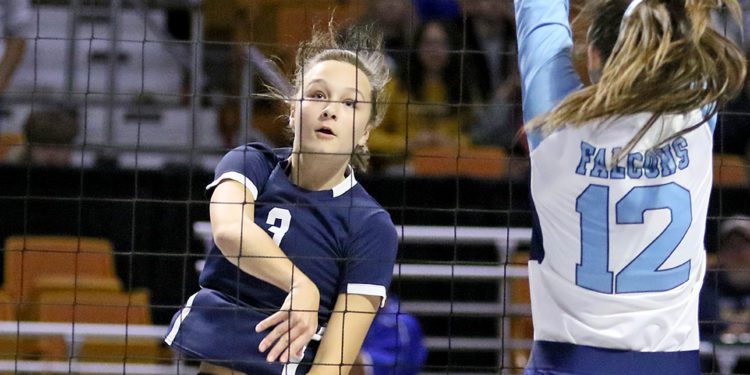 (Brad Davis/For LootPress) Shady Spring's Meg Williams attacks as Frankfort's Arin Lease defends during first round action at the State High School Volleyball Tournament last year at the Charleston Civic Center.