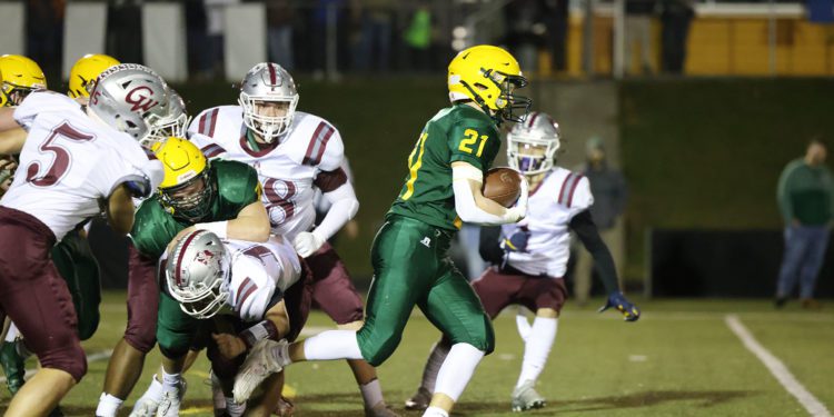 Greenbrier East’s Ian Cline (21) runs through George Washington’s defense during their high school football game in Fairlea on Friday, Nov. 12, 2021 (Photo by Chris Jackson)