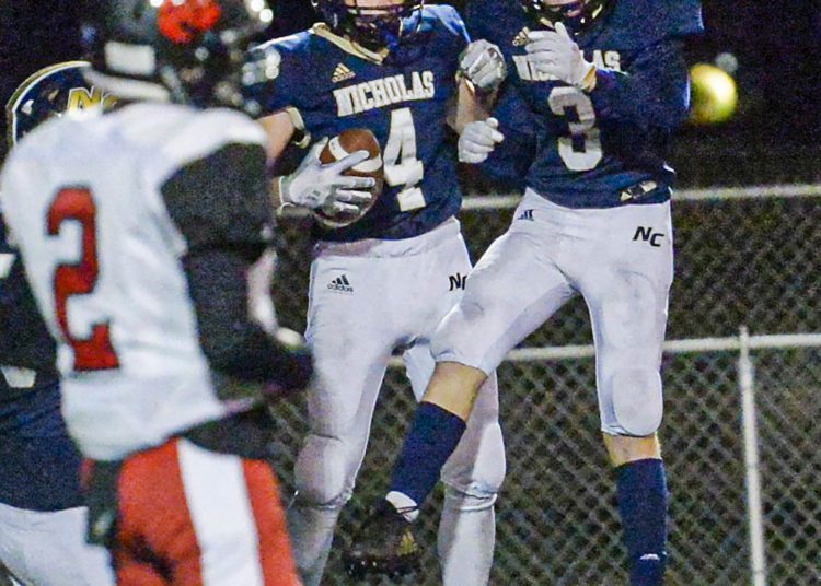 Nicholas County’s Alex Pritt, left, and Jaxson Morriston celebrate Pritt’s TD run during Friday action in Summersville. (F. Brian Ferguson/Lootpress)