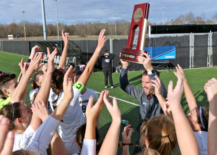 (Brad Davis/For LootPress) Concord head coach Luke Duffy hoists the regional championship trophy with his players after defeating West Chester in the NCAA Division 2 Tournament Thursday afternoon at the YMCA Paul Cline Memorial Sports Complex.