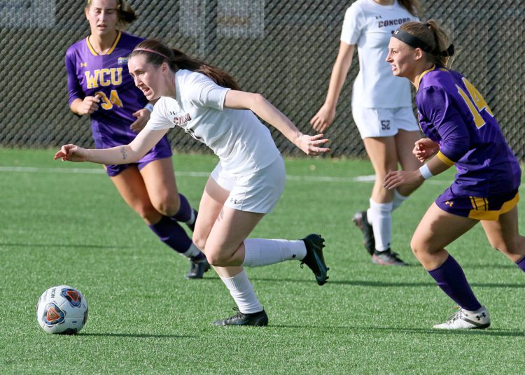 (Brad Davis/For LootPress) Concord's Courtney Smith escapes pressure from West Chester defender Dani Cady Thursday afternoon at the YMCA Paul Cline Memorial Sports Complex.