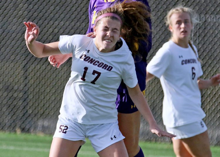(Brad Davis/For LootPress) Concord's Olivia Bekeleski heads the ball away from West Chester's Erin Greiner Thursday afternoon at the YMCA Paul Cline Memorial Sports Complex.