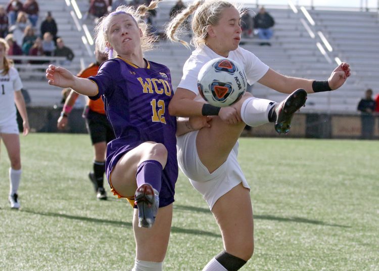 (Brad Davis/For LootPress) Concord's #5 battles for possession with West Chester's Kaitlynn Haughey Thursday afternoon at the YMCA Paul Cline Memorial Sports Complex.