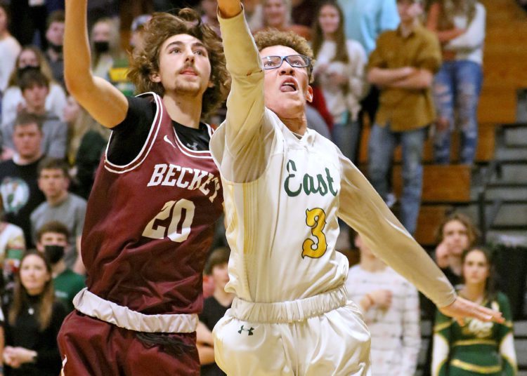 (Brad Davis/For LootPress) Greenbrier East's Adam Seams drives to the basket as Woodrow Wilson's Landyn Wolfe defends Friday night in Fairlea.