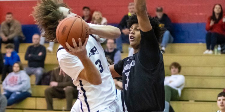 Independence's Cyrus Goodson goes up for a layup against Westside's Ashton Reed during the two teams' meeting on Dec. 21 in Coal City.
File Photo By Heather Belcher