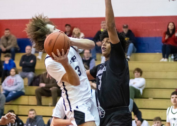 Independence's Cyrus Goodson goes up for a layup against Westside's Ashton Reed during the two teams' meeting on Dec. 21 in Coal City.
File Photo By Heather Belcher