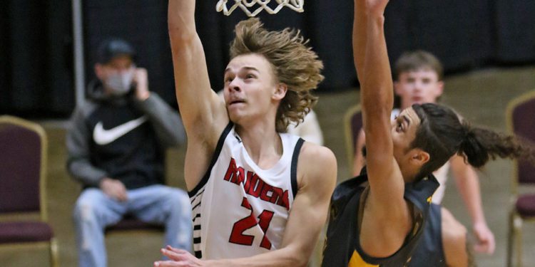 (Brad Davis/For LootPress) Liberty's Adam Drennen drives and scores against Mount View during New River Invitational action Wednesday night in Beckley.