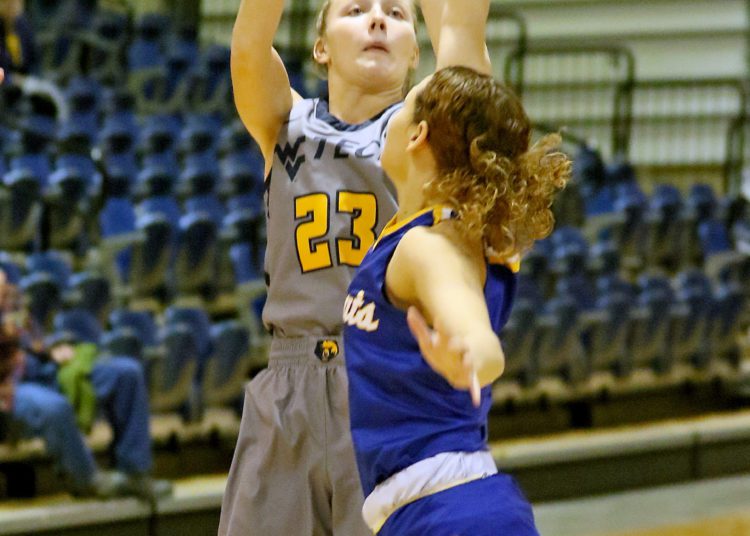 (Brad Davis/For LootPress) WVU Tech's Brittney Justice shoots from three-point range as Brescia's Alecea Homer defends Saturday afternoon in Summersville.