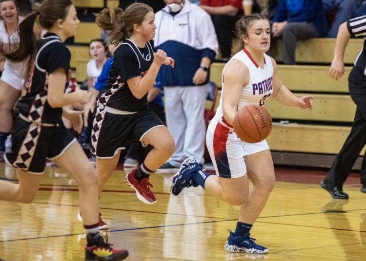 Independence's Chloe Honker dribbles the ball up the court during a gamma against Liberty on Jan. 22 (Heather Belcher/File Photo)
