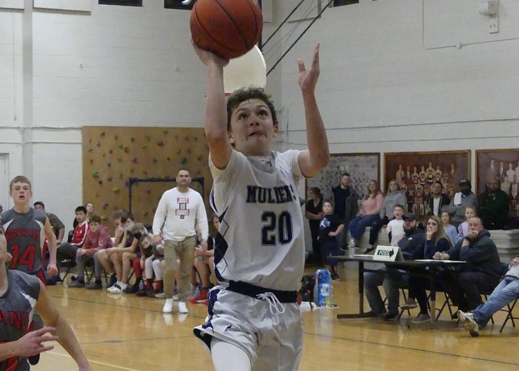 Mullens' Talon Muscari puts up a floater against Oceana on Jan. 12