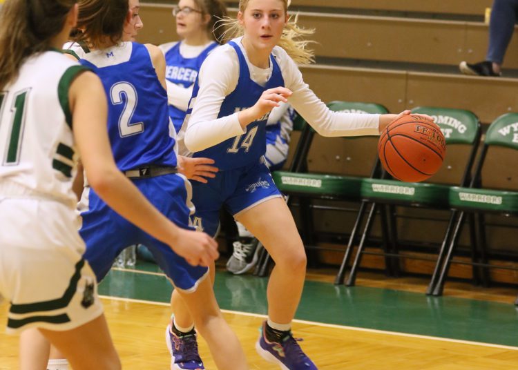 (Brad Davis/For LootPress) Mercer Christian's Kayley Trump drives to the basket against Wyoming East Thursday night in New Richmond.