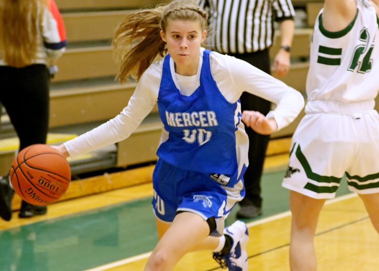 (Brad Davis/For LootPress) Mercer Christian's Karis Trump drives to the basket against Wyoming East Thursday night in New Richmond.
