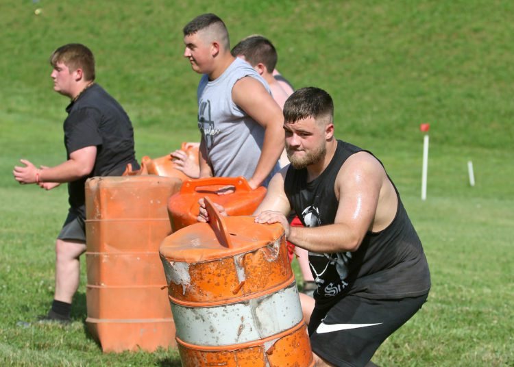 (Brad Davis/For LootPress) Westside football players work through drills during practice June 15 in Clear Fork.