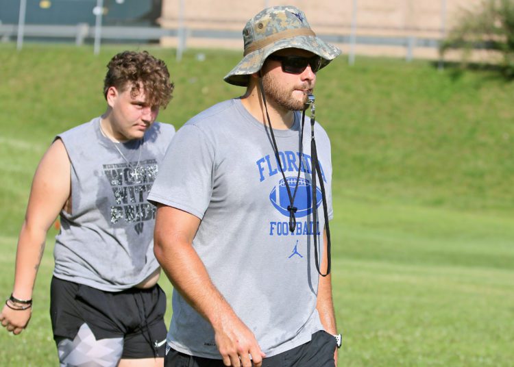 (Brad Davis/For LootPress) Westside head coach Justin Cogar watches his players as they work through drills during practice June 15 in Clear Fork.