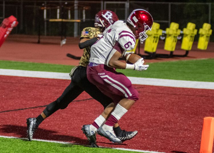 RJ Hairston hauls in a pass against Beckley on Sept. 17 (File Photo by Heather Belcher)