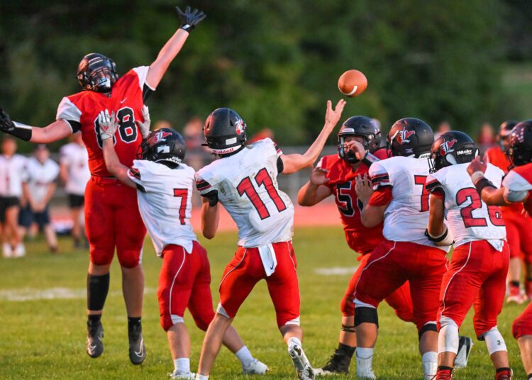 The PikeView defensive line pressures Liberty QB Dalton Williams during their game on Sept. 9 in Gardner (File Photo by Greg Barnett)
