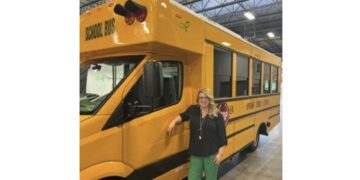 GreenPower’s Sr. Manager of Human Resources Taylor Freeland at the South Charleston, West Virginia manufacturing facility with the all-electric Type A Nano BEAST school