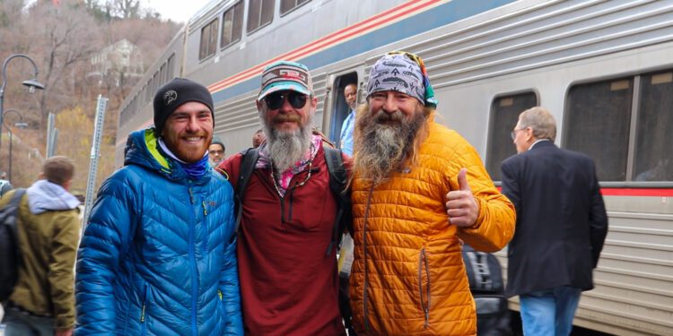 Lovell (center) is greeted by friends after arriving back home in Harpers Ferry | Lootpress photo