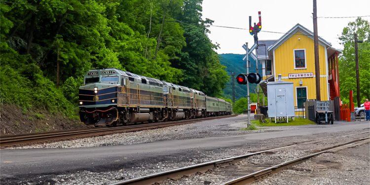 The CSX Office Car Special rolls by the historic Thurmond Depot in Fayette County.