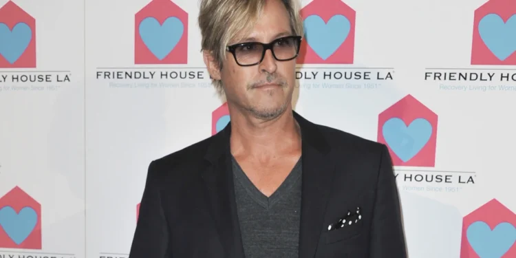 Charlie Colin appears at the Friendly House Los Angeles' 24th Annual Awards Luncheon on Oct. 26, 2013 in Los Angeles. Colin, bassist and founding member of the American pop-rock band Train, best known for their early-aughts hits like "Drops of Jupiter" and "Meet Virginia," has died. He was 58. (Photo by Richard Shotwell/Invision/AP, File)
