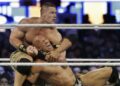 Wrestler John Cena, top, chokes Dwayne Douglas

Johnson, known as The Rock, as they wrestle, April 7, 2013, in East

Rutherford, N.J., during Wrestlemania. Cena announced Saturday,

July 6, 2024, that he will retire from professional wresting next

year after two decades in the ring. (AP Photo/Mel Evans, File)
