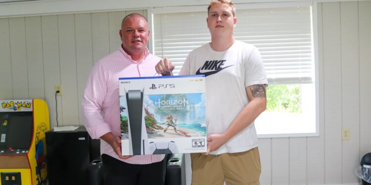 Brandon Steele presents a new PS5 to Matt Nelson at Burlington United Methodist Family Services in Beckley | Lootpress photo