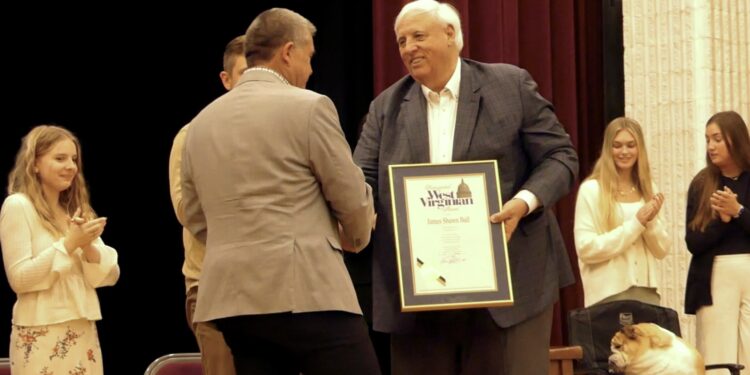 Governor Justice presents Shawn Ball with the "Distinguished West Virginian" award