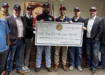 Left-to-right: Brandon Ellison, Erik Bower, Commission President Greg Duckworth, Benjaman Worley, Trap Hill Little League President Kyle Webb, Field Vice President Justin Brenton, Tyler Webb, Commissioner Danial Hall, Adam Buchanan