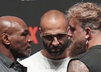 Mike Tyson, front left, and Jake Paul, front right, face off during a news conference ahead of their fight, Wednesday, Nov. 13, fis
2024, in Irving, Texas. (AP Photo/Julio Cortez)