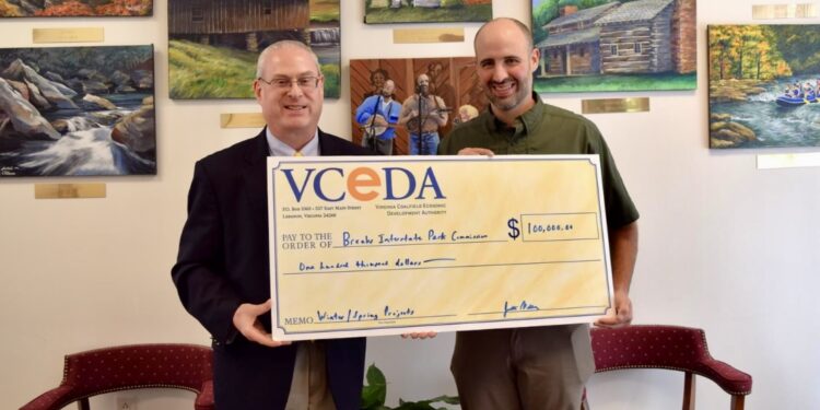 A ceremonial check representing a $100,000 VCEDA grant for Breaks Park Improvements was presented to Breaks Park Superintendent Austin Bradley, right, by VCEDA Executive Director/General Counsel Jonathan Belcher, left. Photo: VCEDA