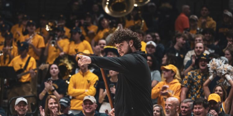 Cade Kincaid, a WVU junior accounting major from Fayetteville, leads a celebratory cheer after being named the 71st Mountaineer mascot Saturday (March 8) at the Coliseum. (WVU Photo/Brian Persinger)