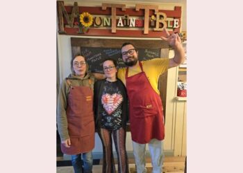 Caption:  The Mountain Table co-owners -- Nicole Petschulat, Nadine Sonneville and Alexander Durand (right to left) -- are well known for their roasting and distribution of coffee, farm-to-table restaurant, and high profile in the community at fairs and festivals.
